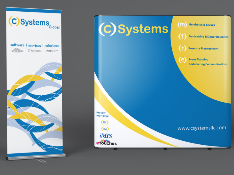 (C) Systems trade show booth and rollup banner
